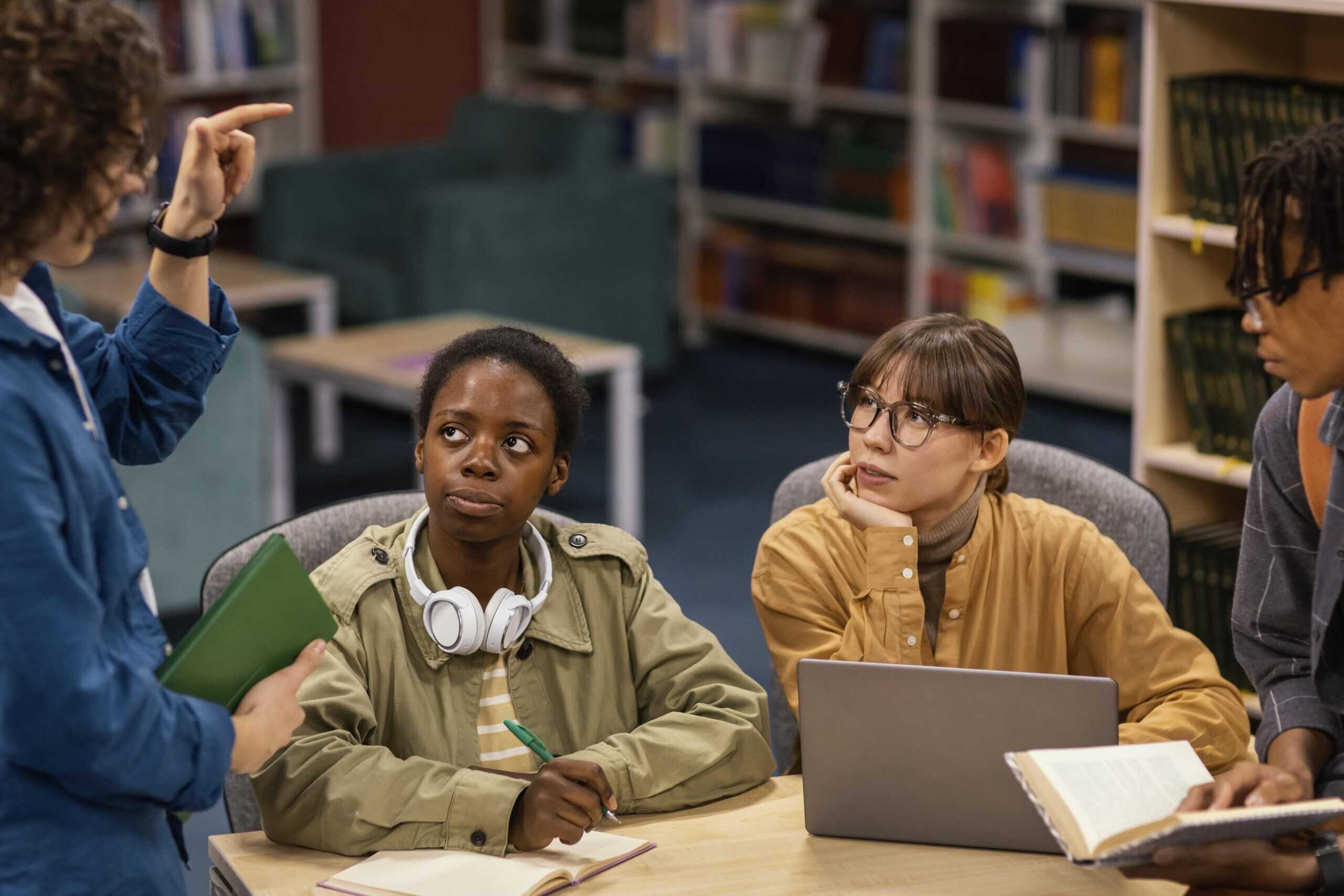 Four university students studying together.