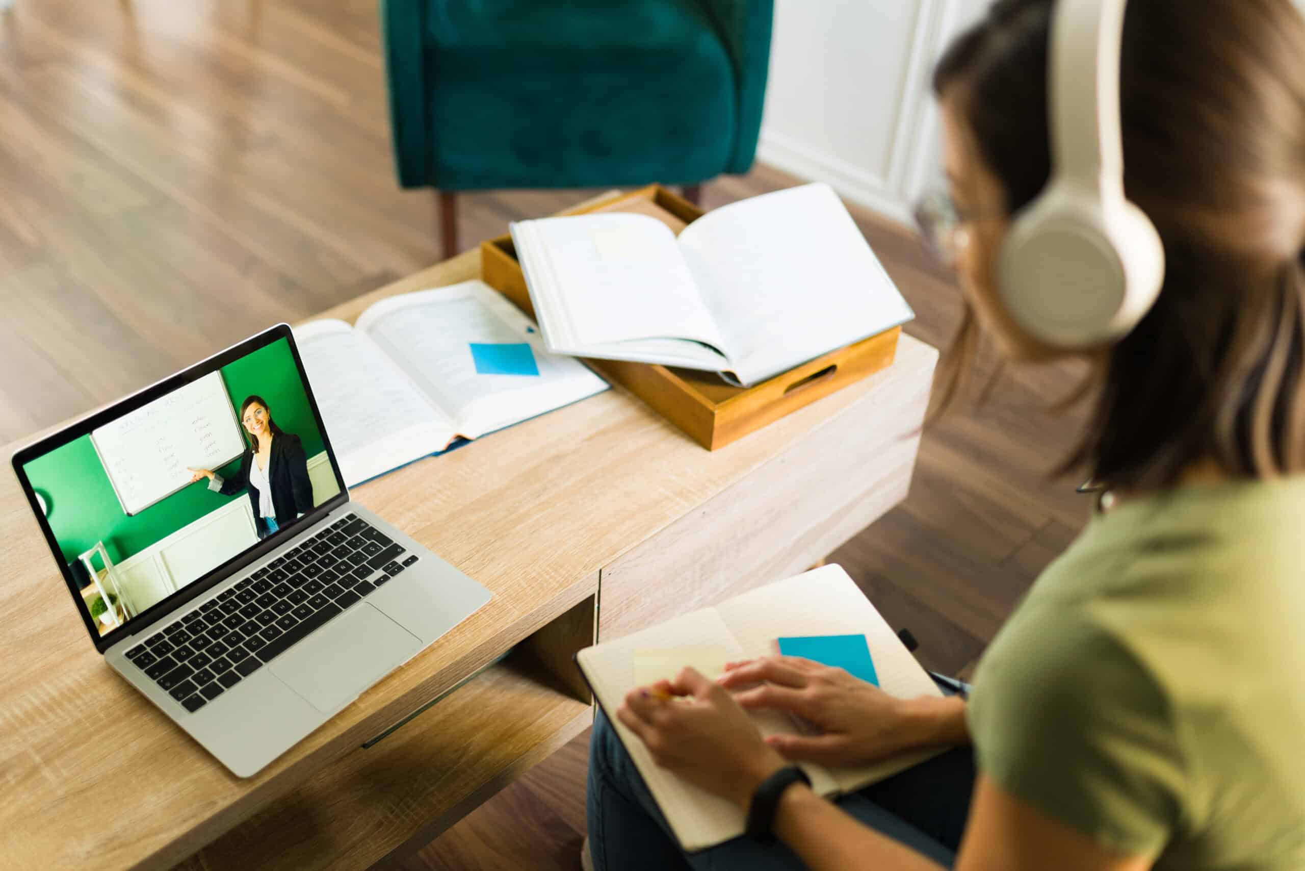 A university student watches an online lecture.