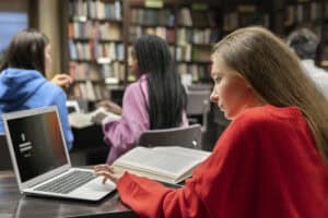 A student using her laptop while studying.